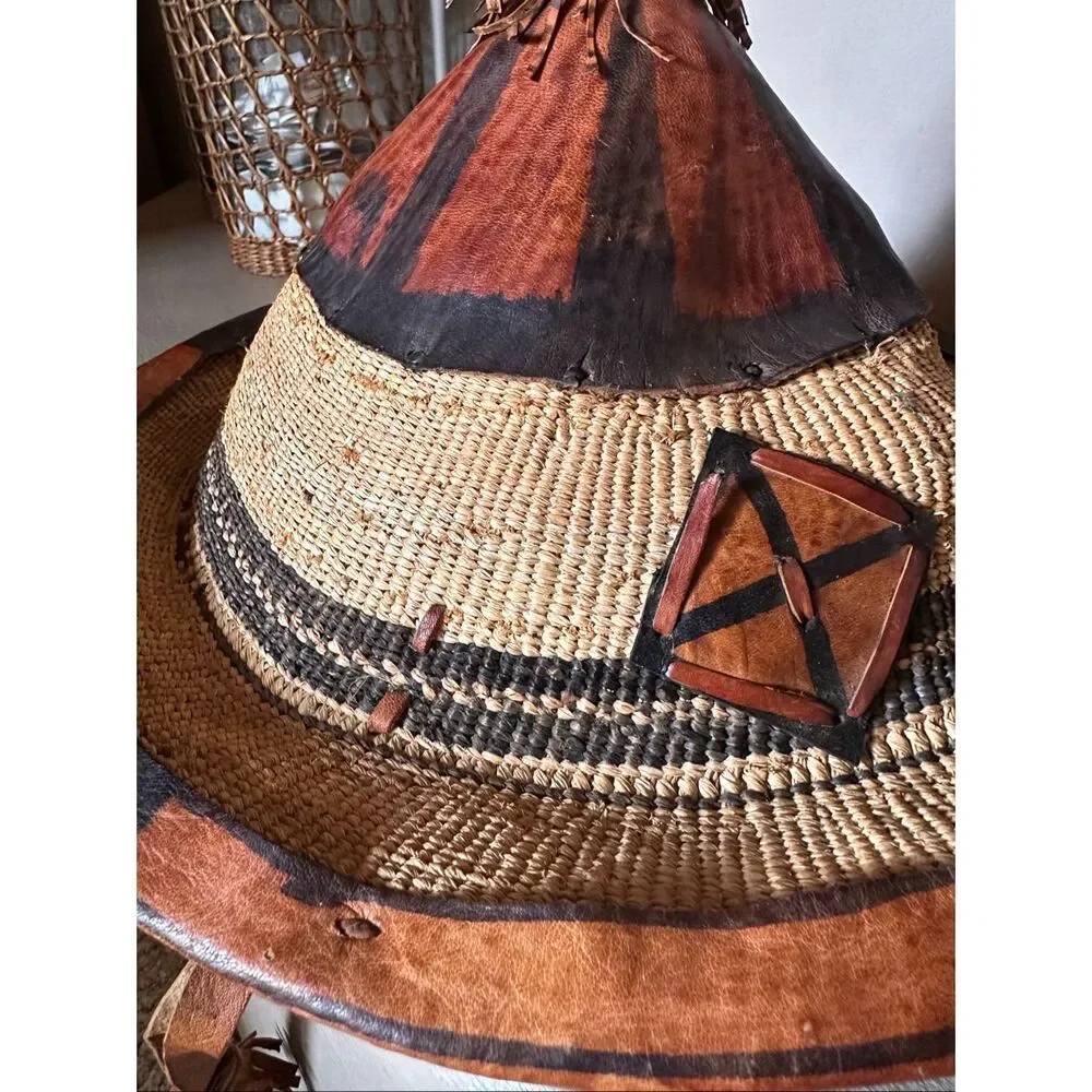 Vintage handwoven basketry hat with leather trim. Tribal/Boho decor